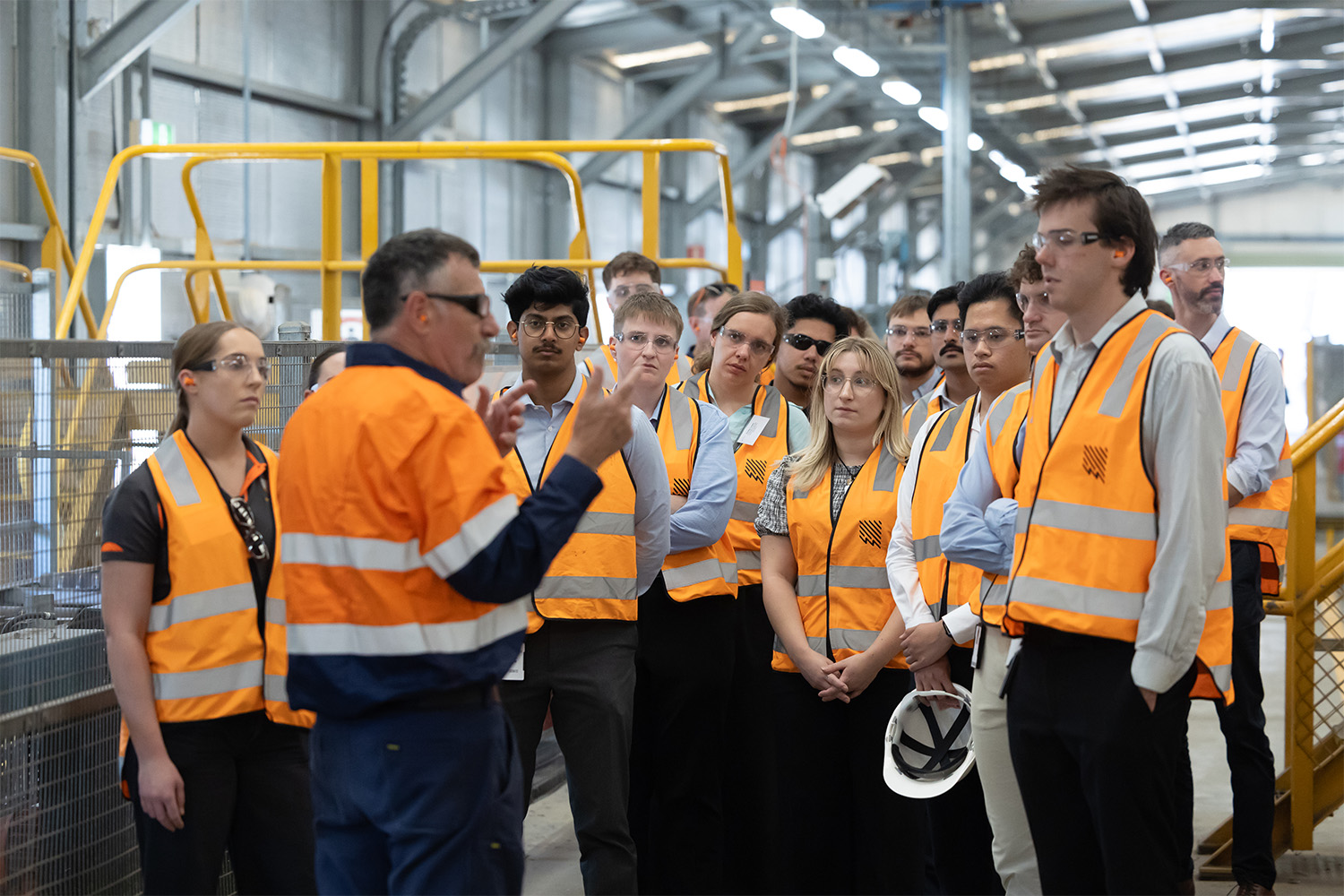 Brian Docking gives a tour of the Stobie pole manufacturing facility to new starters including his daughter Kat. 