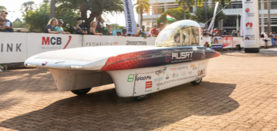 Adelaide University Solar Racing team in Darwin on the Bridgestone World Solar Challenge, with their custom-designed solar vehicle, Lumen II.